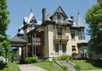 The Beiderbecke mansion is a unique example of Stick style architecture prevalent during the Victorian era complete with a tower, turret and balconies.