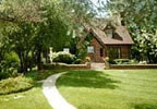 Ames, Iowa Bed and Breakfast: A charming Tudor home, located just a few blocks from the ISU campus.  Choose either the Manor Suite, a spacious room with a sitting area, queen brass bed, TV/VCR and private bath with a double whirlpool tub and shower, or the Buttercup Room.  Sumptuous chef's choice gourmet breakfasts in the sunny dining room feature home-baked breads and delicacies using Iowa products. 