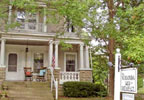 Welcoming wide front porch opens to foyer with superb crystal chandelier, comfortable living room has fireplace, common TV and stained glass window. Large master bedroom has queen-sized bed and double sleeper/sofa.