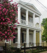 New Orleans, Louisiana (LA) Bed & Breakfast: All guests have access to the beautful living room, dining room, and updated kitchen/den in the main house. There are four spacious guestrooms, each with a private entrance and private bath. Each room is furnished with antiques, a queen-size bed, refrigerator, and coffee maker in the room. Telephone, answering machine, and a dataport is available in each room. Two of the rooms opening to a lovely courtyard may be combined as a 2 bedroom suite for 4 people. There is limited off street parking upon request.