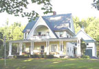 Bridgton, Maine Bed and Breakfast: Nestled in the heart of Western Maine's Lakes & Mountains region only forty miles from Portland, Noble House sits gracefully above scenic Highland Lake in the quaint town of Bridgton. Originally a senator's estate, our historic Victorian is surrounded by sprawling lawns and stone walls, towering oaks and a century-old pine grove. Breath in the crisp mountain air from your screened porch, or let the whirling bubbles of a Jacuzzi tub melt away your cares before nestling beneath luxurious linens in one of our antique-furnished guestrooms or luxury suites.