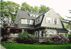 Tanglewood Hall located in York Harbor, Maine is a fifteen room shingled cottage, elegant in it's wooded surroundings and carefully chosen furnishings.