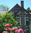 Newark, New York (NY) Bed & Breakfast: Formerly the Jackson & Perkins Rose Company Estate this historic 1840's Tudor is gracefully poised on a park-like setting, which includes formal gardens and woodlands. Tastefully furnished with antiques, each of our four guest rooms has a view of the gardens and its own distinctive feel to make your stay with us a memorable one.