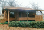 Spiro, Oklahoma, OK, Bed & Breakfast: Experience this charming log cabin in a quaint and peaceful atmosphere. Located on an 80-acre cattle ranch, enjoy nature by hiking the wooded ridge, fishing, playing basketball, bird watching or relaxing in the hot tub. This romantic getaway is cheerfully decorated with high ceiling beams, handmade quilts and baskets. Breakfast served in Jan's country kitchen or brought to your door. TV and VCR, complimentary refreshments, pasture golf, outside grill. Handicapped accessible.