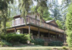 Carlton, Oregon Bed & Breakfast: Established in the summer of 2001, the Lobenhaus Bed & Breakfast is nestled in a peaceful wooded setting of 27 acres near Carlton, Oregon. Each guestroom has private bath, individual heating/cooling plus additional access to a deck overlooking a spring-fed pond. Relax in two common living rooms, each with television and fireplace. Enjoy a hearty full breakfast. Close to antique shops, wineries, fresh air strolling or riding, and fine dining.